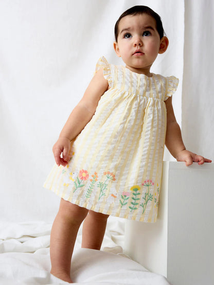 Robe bébé écrue à broderies florales