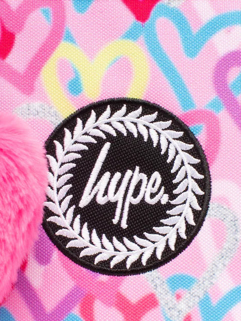 Boîte à lunch rose fluo avec un motif de cœurs pailletés.