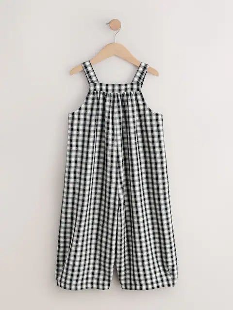 Combinaison enfant à carreaux noir et blanc style ample (3-16 ans)