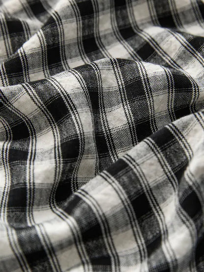 Combinaison enfant à carreaux noir et blanc style ample (3-16 ans)