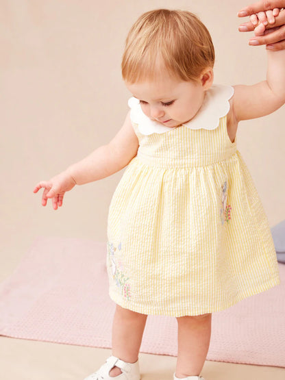Robe bébé jaune pastel à col Claudine